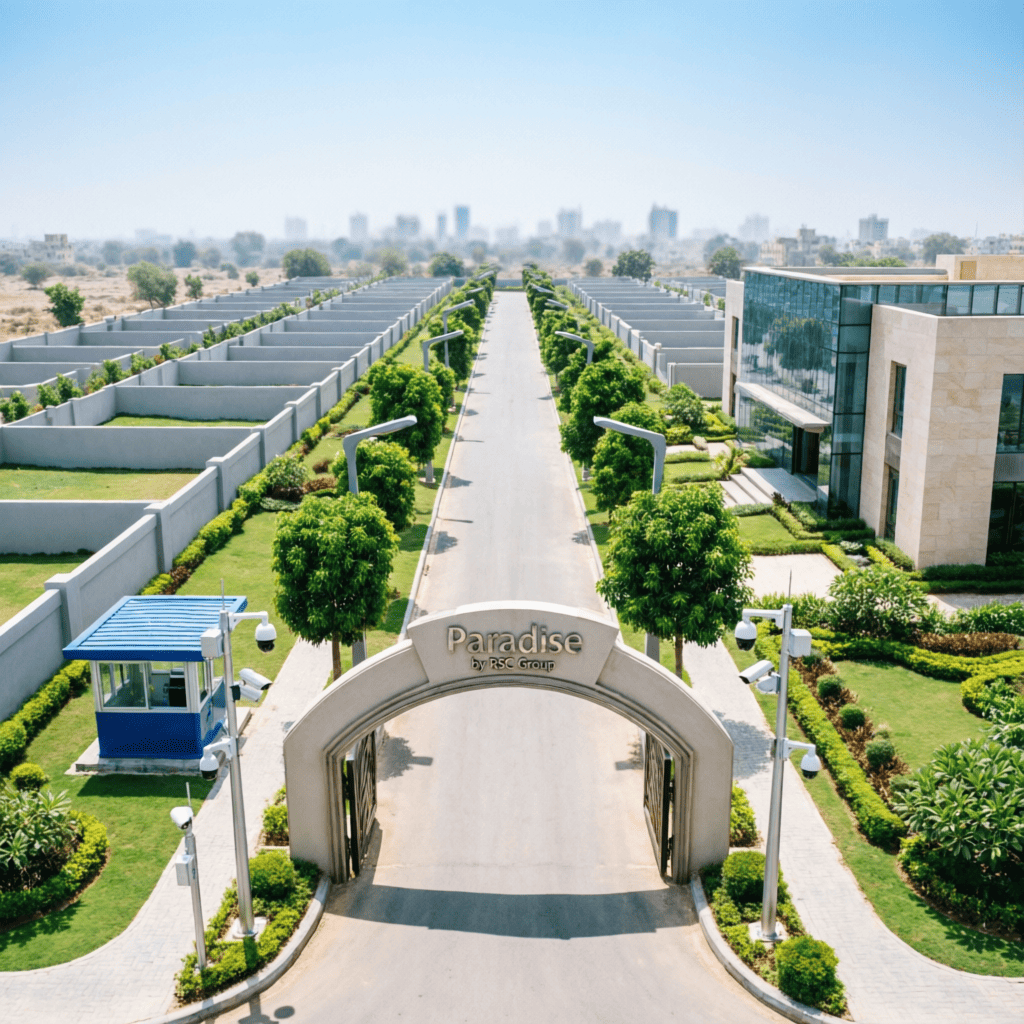 Paradise premium residential plotted township by RSC Group Dholera with grand entrance arch boundary wall security cabin CCTV cameras landscaped gardens and club house near Ahmedabad Gujarat